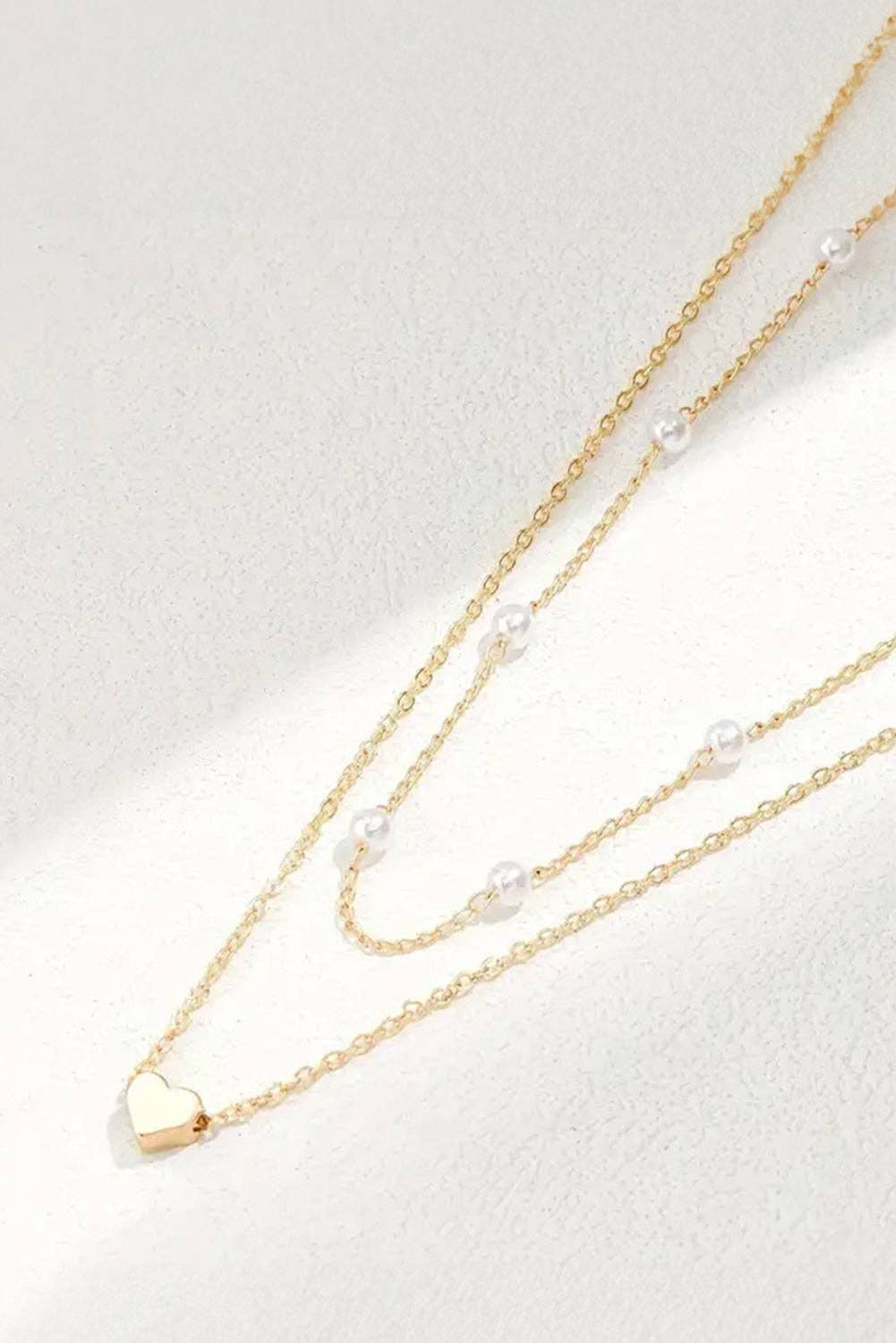 Gold Layered Necklace with Heart Pendant and Pearl Accents